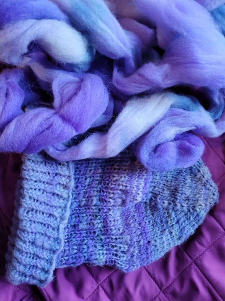 blue dyed Rambouillet roving and knitted hat