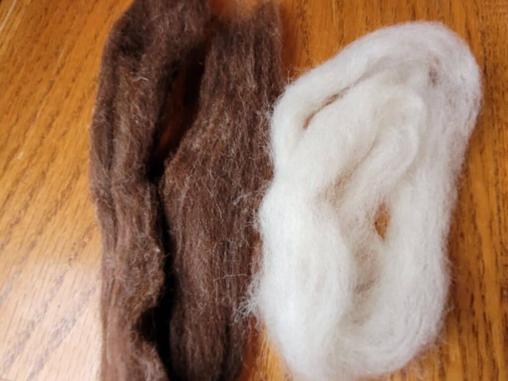 pindrafted alpaca and wool roving next to corriedale roving