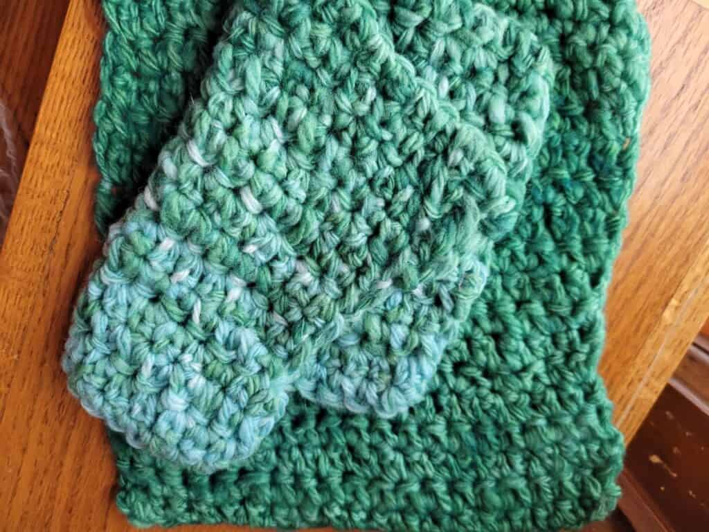 green potholders, one dyed after crocheting, one dyed before crocheting