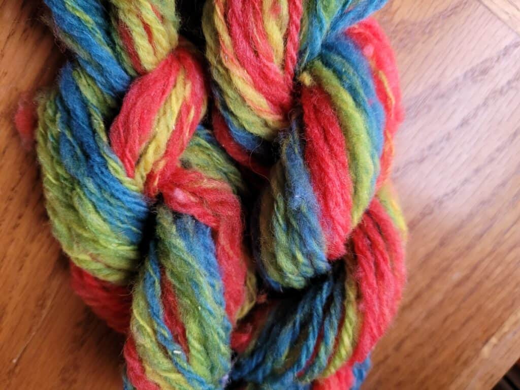 red, green and blue yarn made of Dorset cross and Polypay wool, chain plied