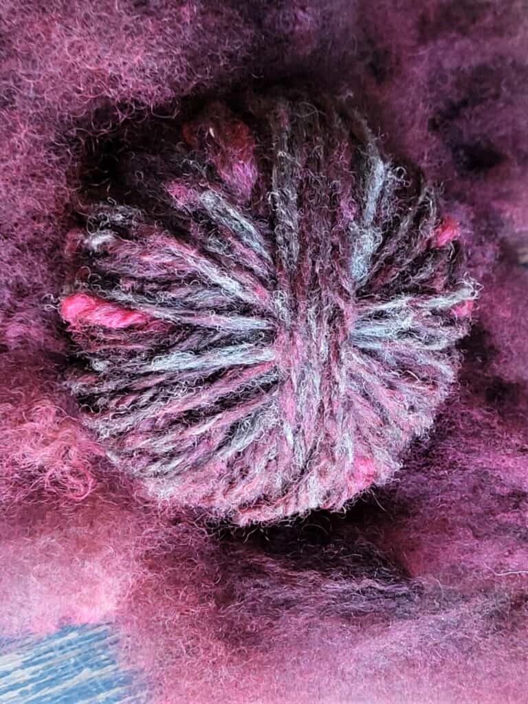 multi colored yarn spun from over dyed naturally colored fleece