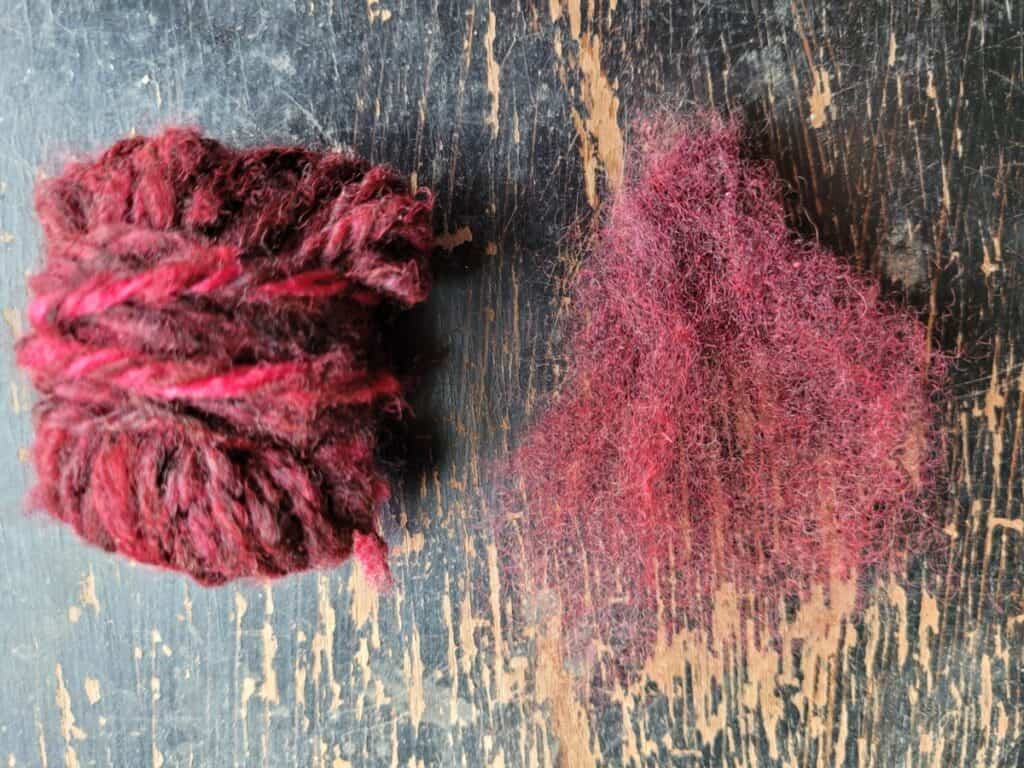 flick carded lock of wool and yarn spun from flick carded wool, wool was natural colored fleece over dyed with hot pink